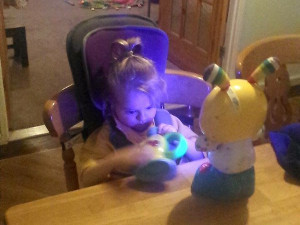 2016: This special chair for Poppy allows her to sit at the table with her family
